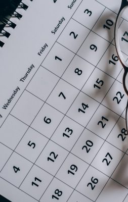 brown framed eyeglasses on a calendar